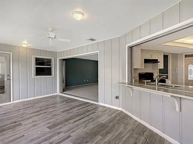 a view of a kitchen from the hallway