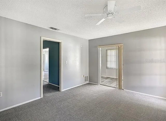 a view of empty room with windows