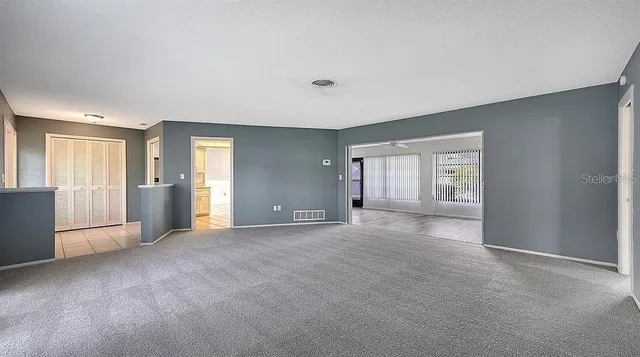 a view of an empty room with a window