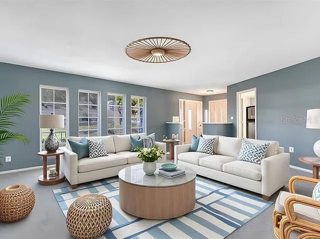 a living room with furniture and a large window