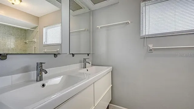a bathroom with a sink and a bathtub