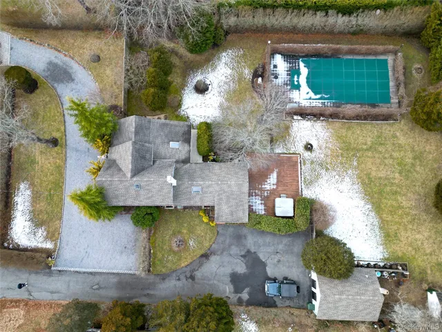 an aerial view of a house with outdoor space