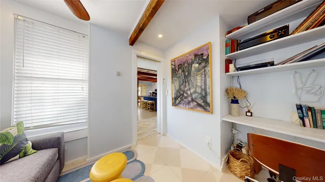 a living room with furniture and a window