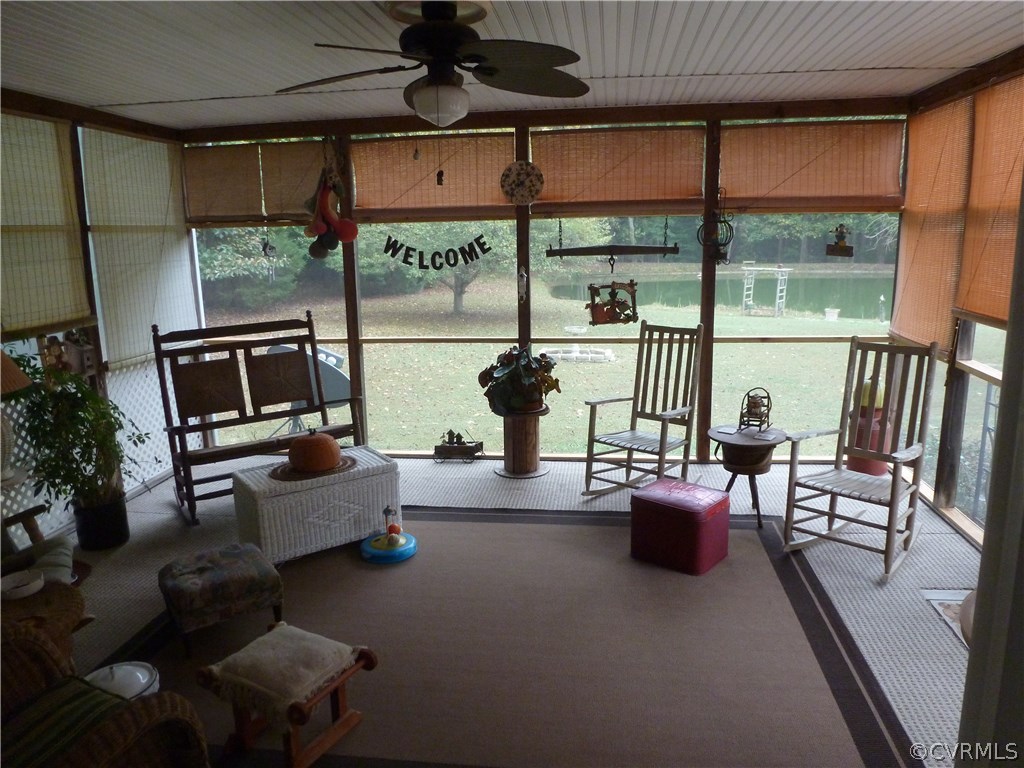8725 Sandy Ridge Road Hopewell, VA 23860 - Photo 15 of 19 a living room with furniture and a floor to ceiling window