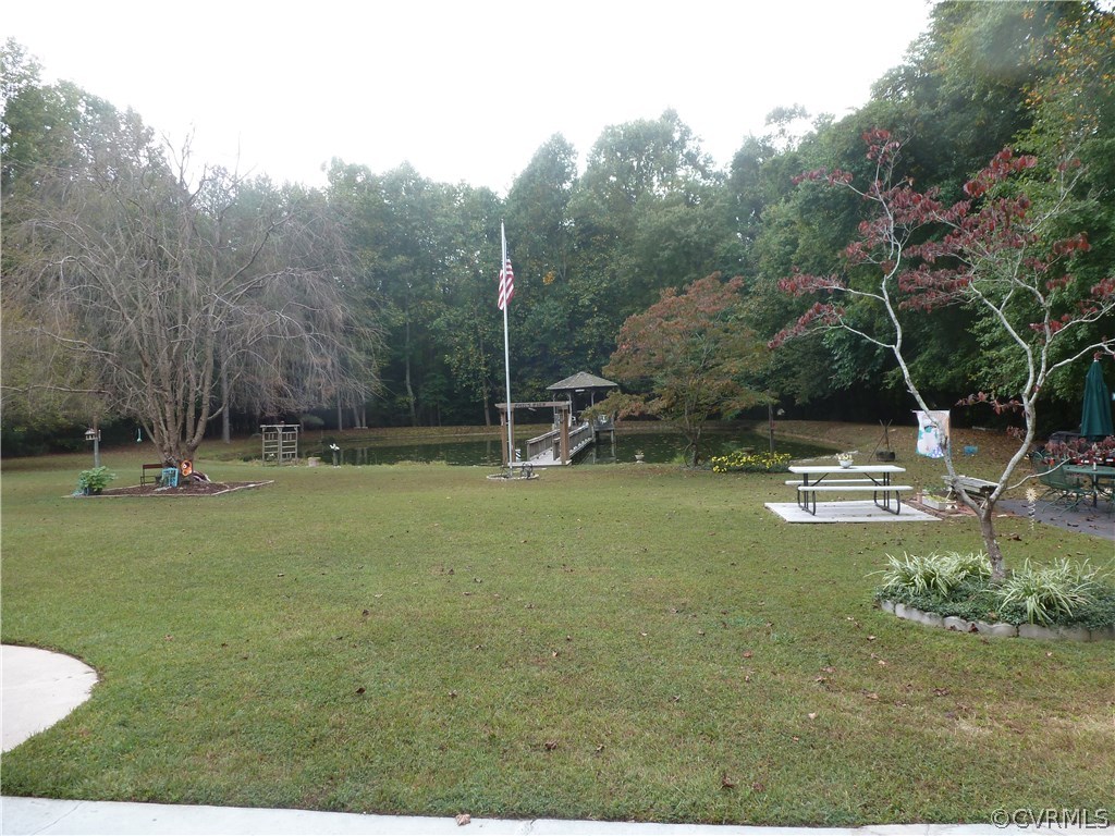 8725 Sandy Ridge Road Hopewell, VA 23860 - Photo 19 of 19 a swimming pool with lots of trees