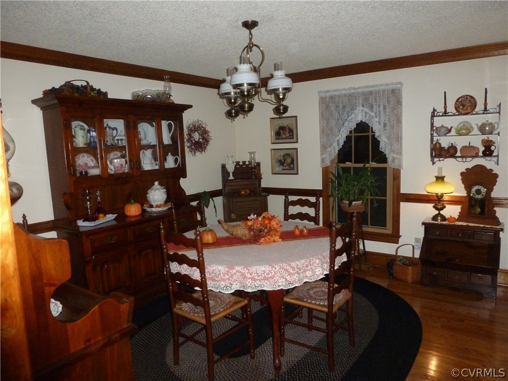 8725 Sandy Ridge Road Hopewell, VA 23860 - Photo 5 of 19 a view of a dining room with furniture and chandelier