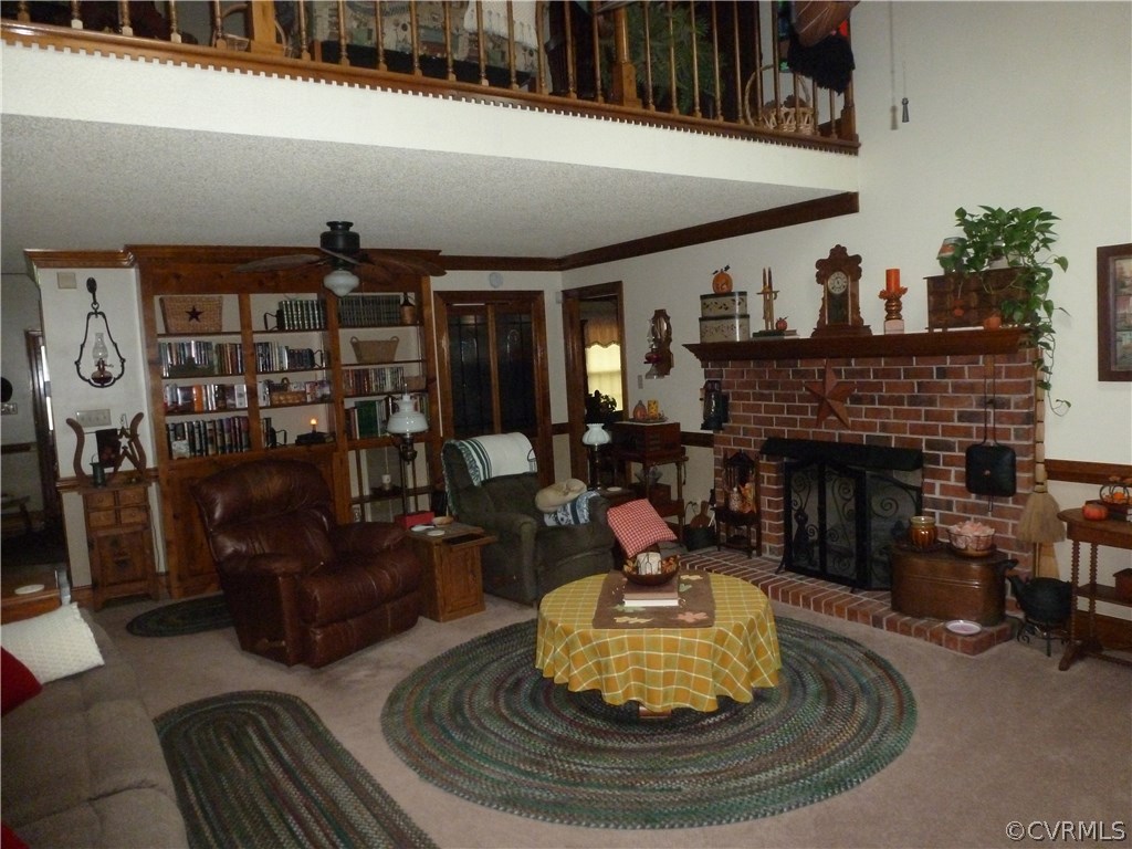 8725 Sandy Ridge Road Hopewell, VA 23860 - Photo 6 of 19 a living room with furniture and a fireplace