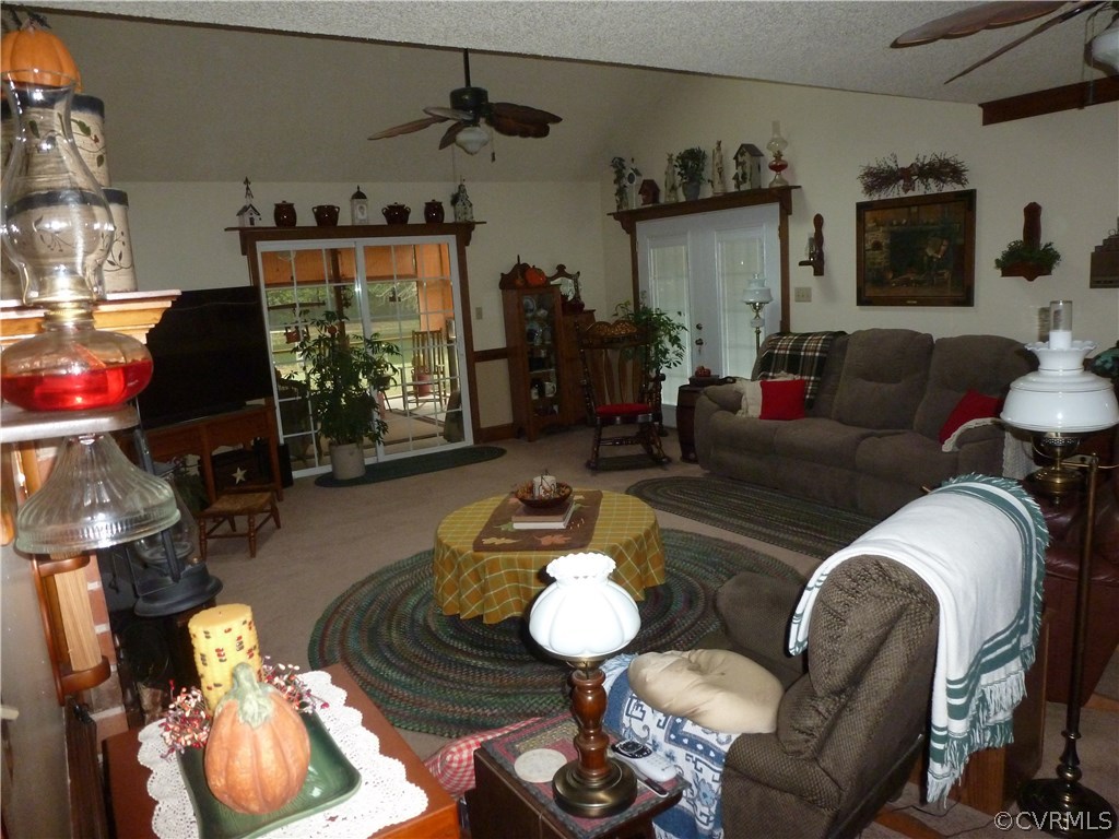 8725 Sandy Ridge Road Hopewell, VA 23860 - Photo 7 of 19 a living room with furniture and a chandelier