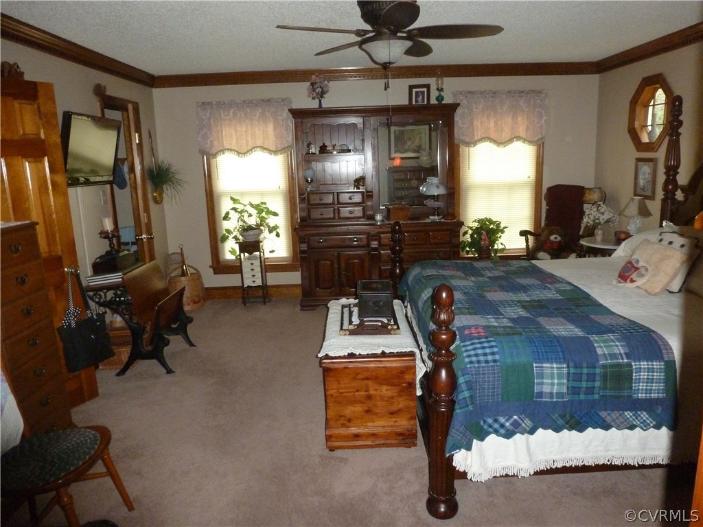 8725 Sandy Ridge Road Hopewell, VA 23860 - Photo 9 of 19 a room with furniture and a chandelier