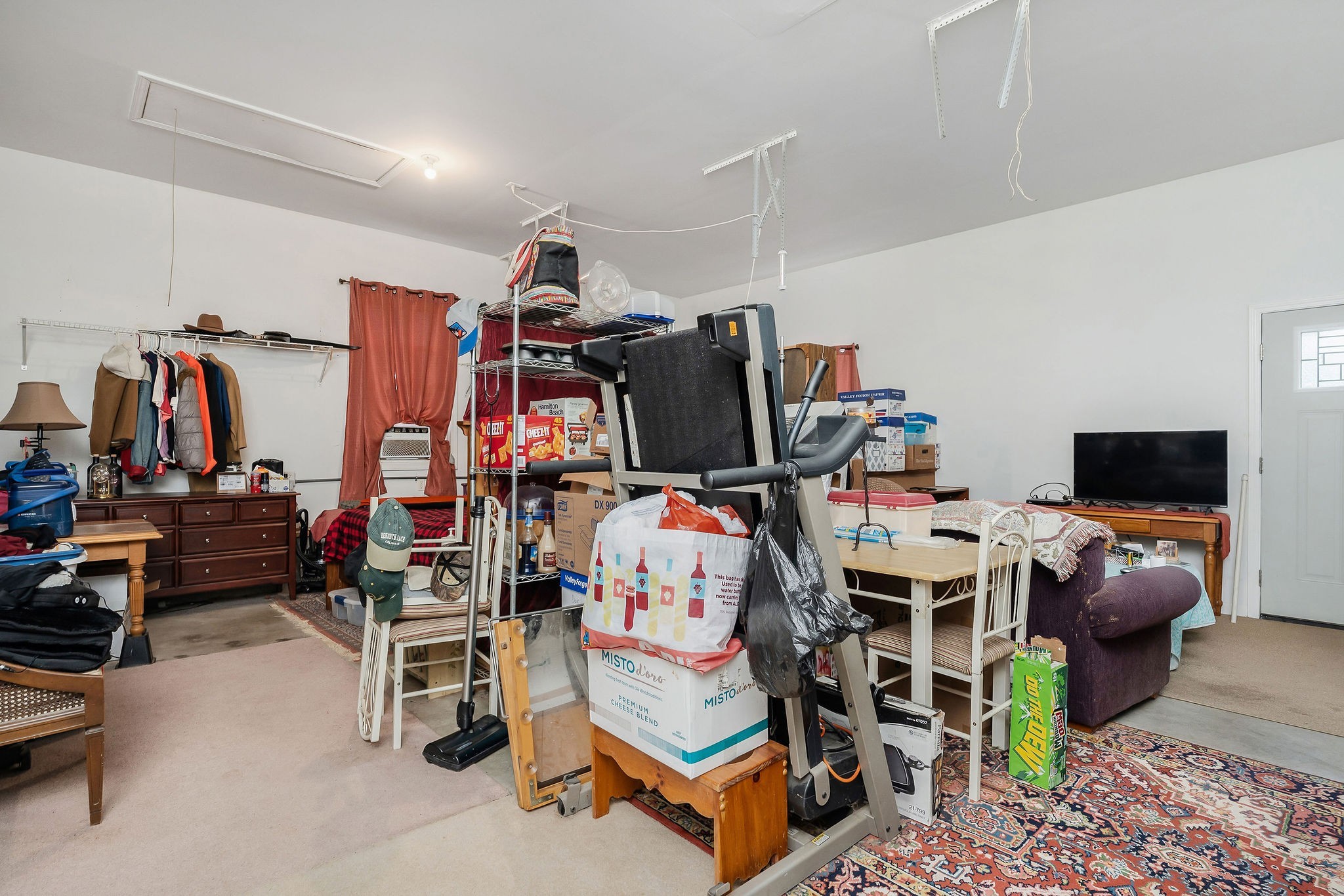 1565 Canada Flatt Road Cookeville, TN 38506 - Photo 19 of 28 a living room with furniture a air conditioner vent and a flat screen tv