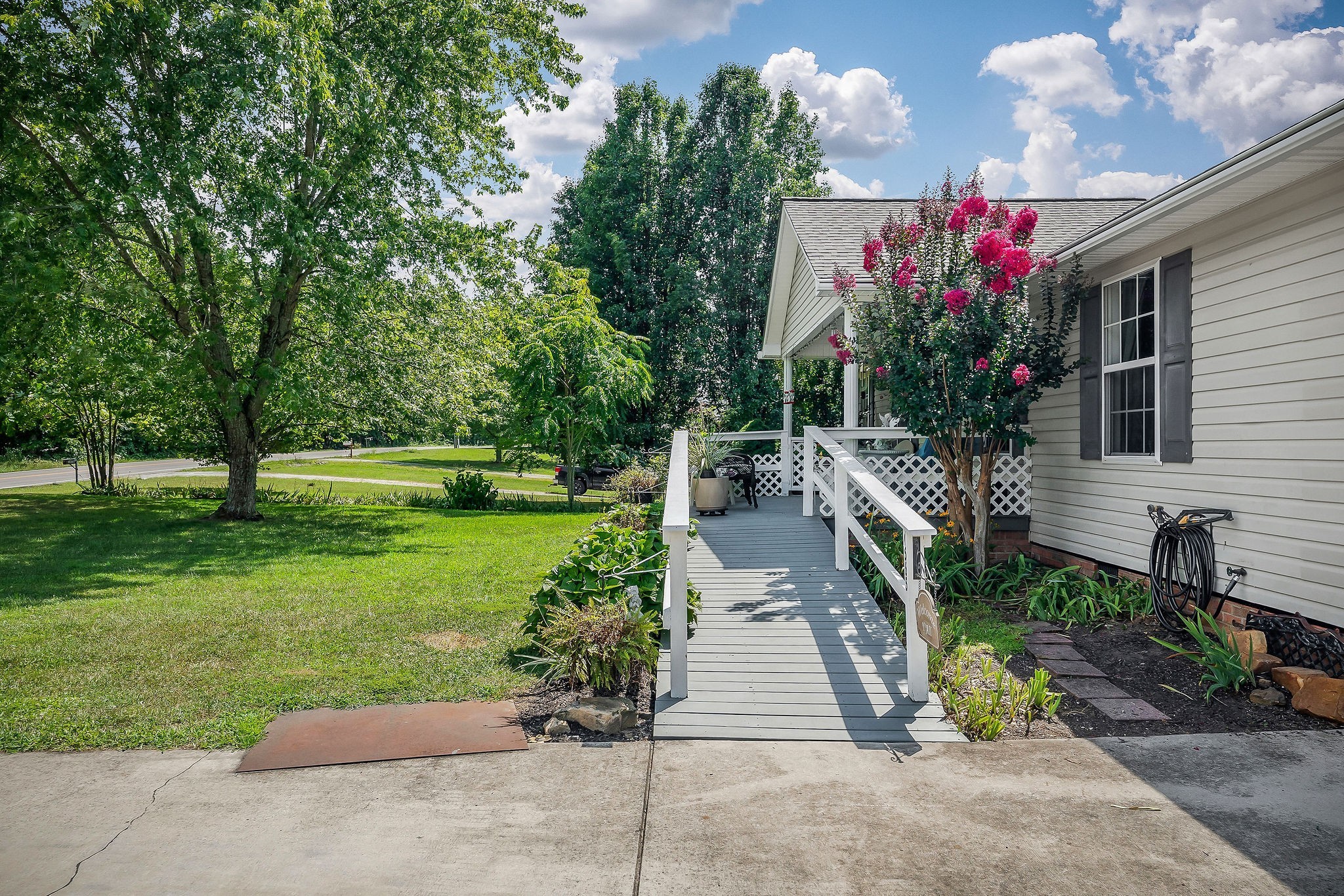 1565 Canada Flatt Road Cookeville, TN 38506 - Photo 25 of 28 a view of a garden with flowers and trees