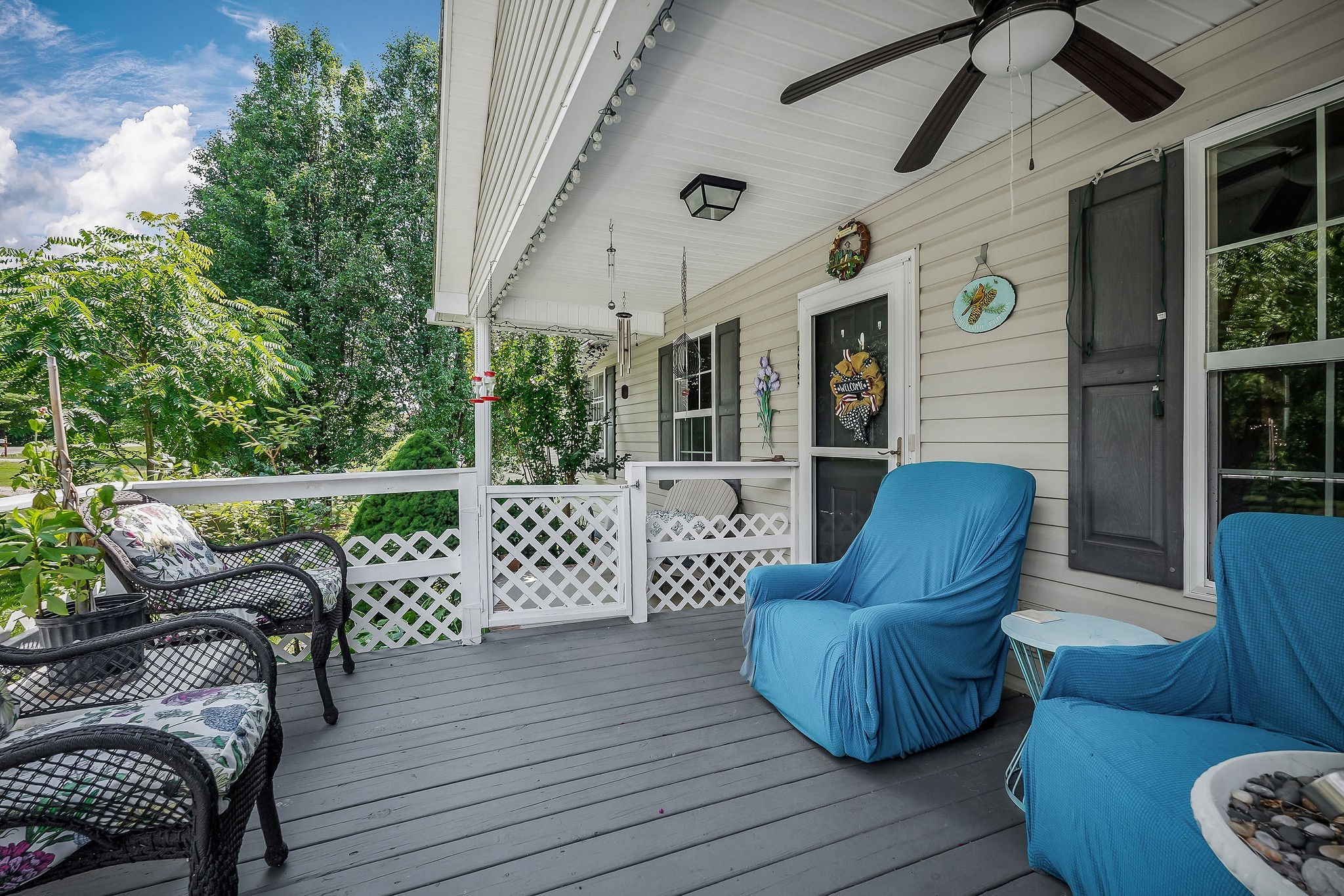 1565 Canada Flatt Road Cookeville, TN 38506 - Photo 27 of 28 a view of a patio with couches chairs and wooden floor