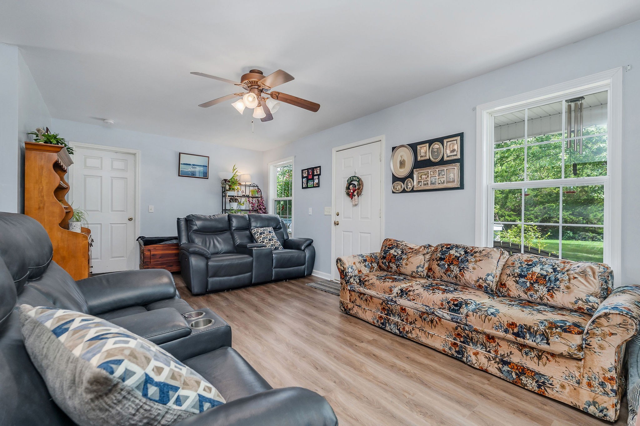 1565 Canada Flatt Road Cookeville, TN 38506 - Photo 5 of 28 a living room with furniture large window and a chandelier