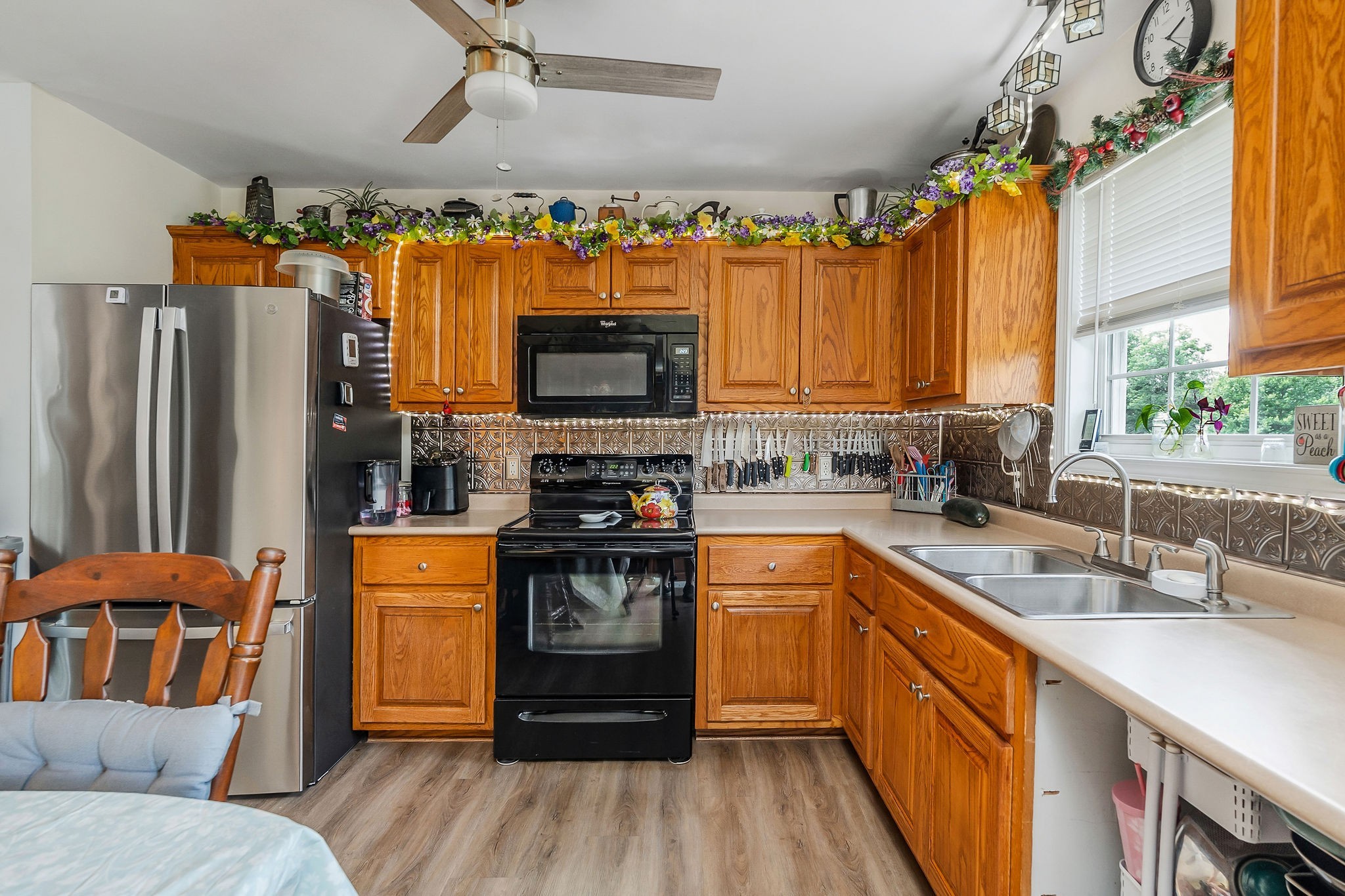 1565 Canada Flatt Road Cookeville, TN 38506 - Photo 8 of 28 a kitchen with stainless steel appliances a stove a sink dishwasher a refrigerator and a microwave