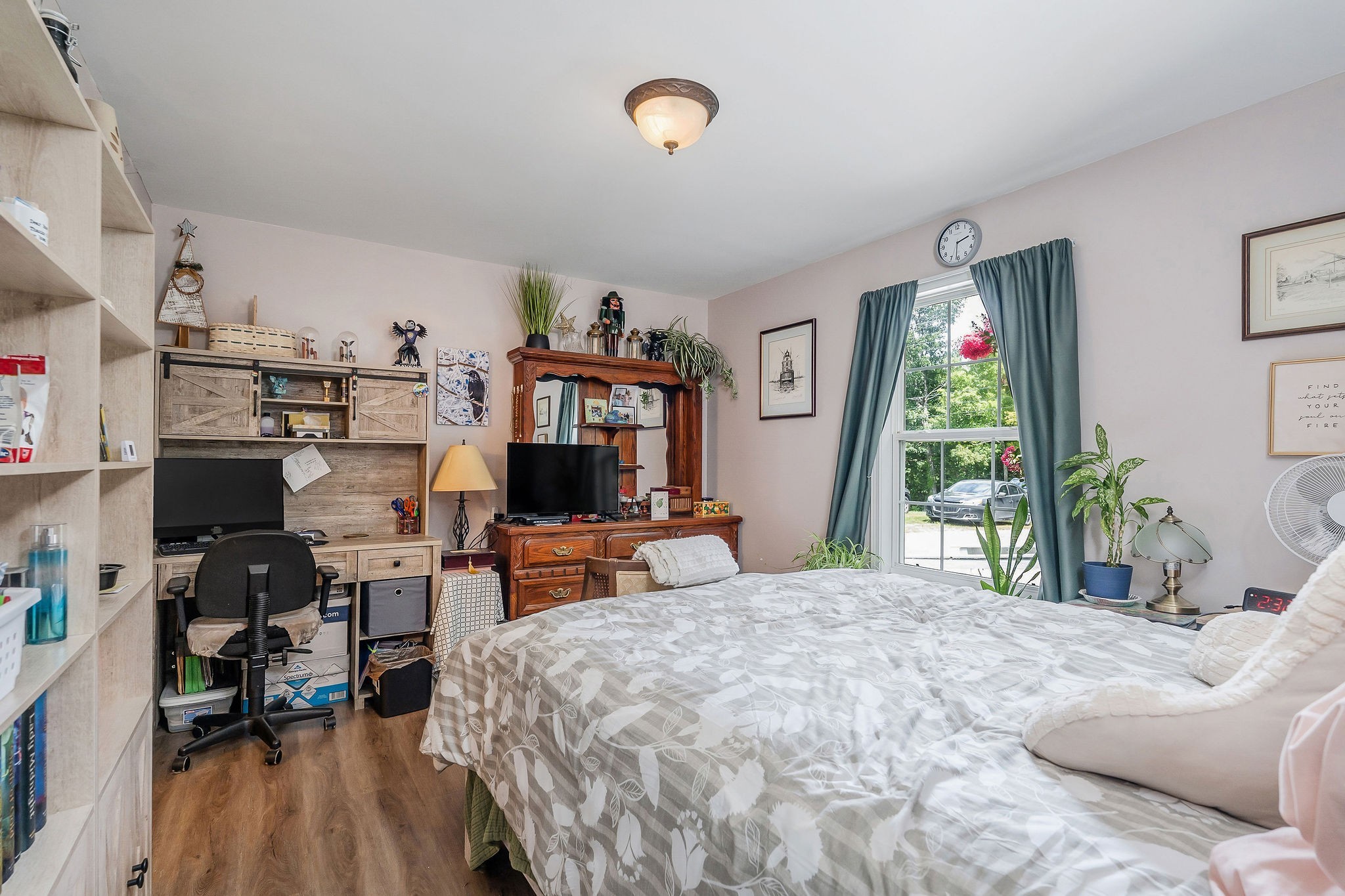 1565 Canada Flatt Road Cookeville, TN 38506 - Photo 9 of 28 a bedroom with a bed a large window and book shelf