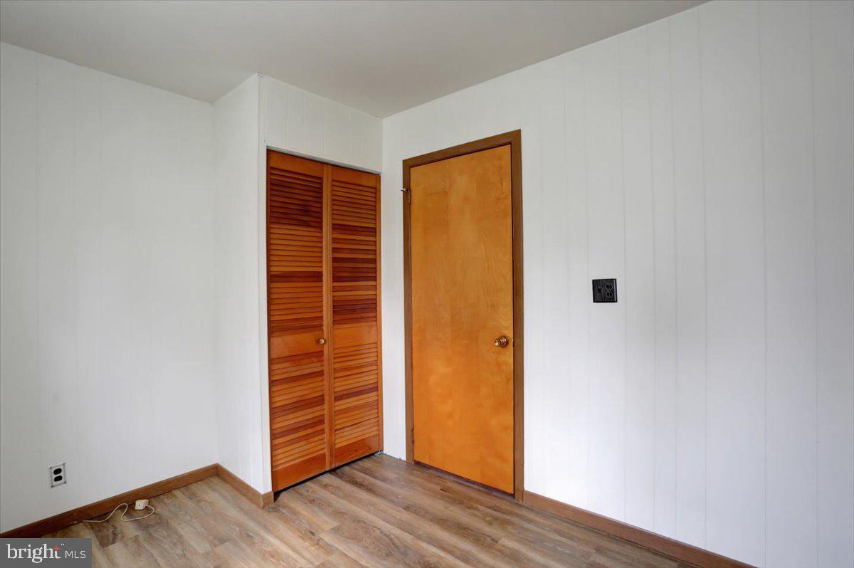 1130 Outer Drive Hagerstown, MD 21742 - Photo 12 of 37 a view of an empty room with wooden floor and closet
