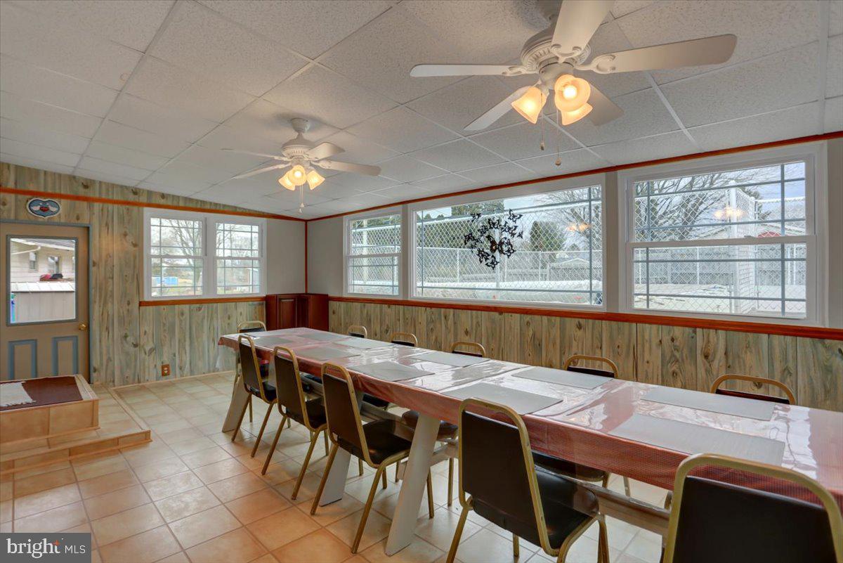 1130 Outer Drive Hagerstown, MD 21742 - Photo 7 of 37 a dining room with wooden floor and chandelier