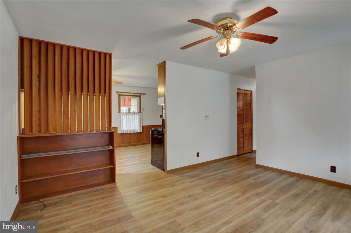 1130 Outer Drive Hagerstown, MD 21742 - Photo 10 of 37 wooden floor in an empty room with a window