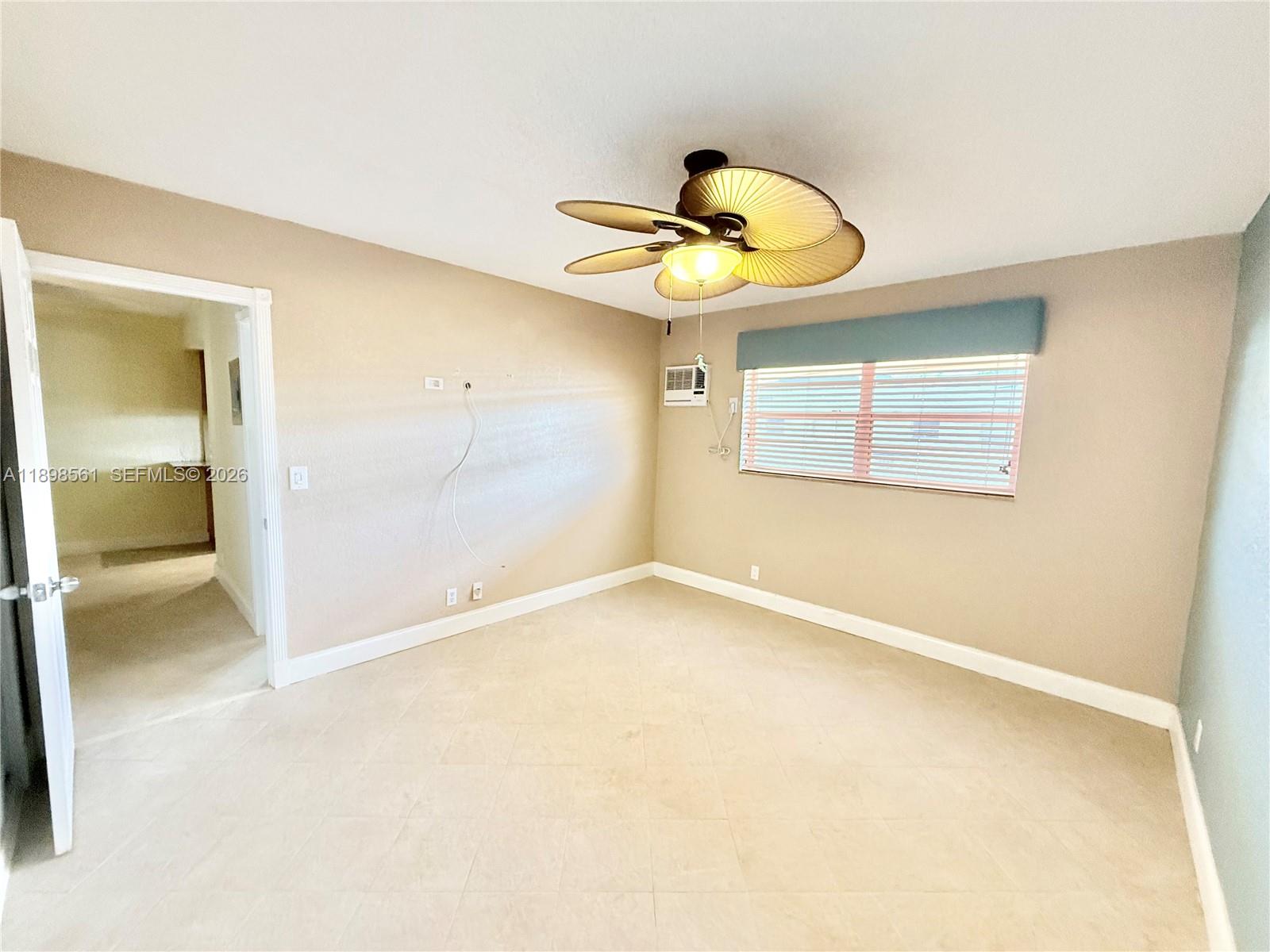 3600 Harrison Street, Unit 16B Hollywood, FL 33021 - Photo 12 of 34 a view of an empty room with a window