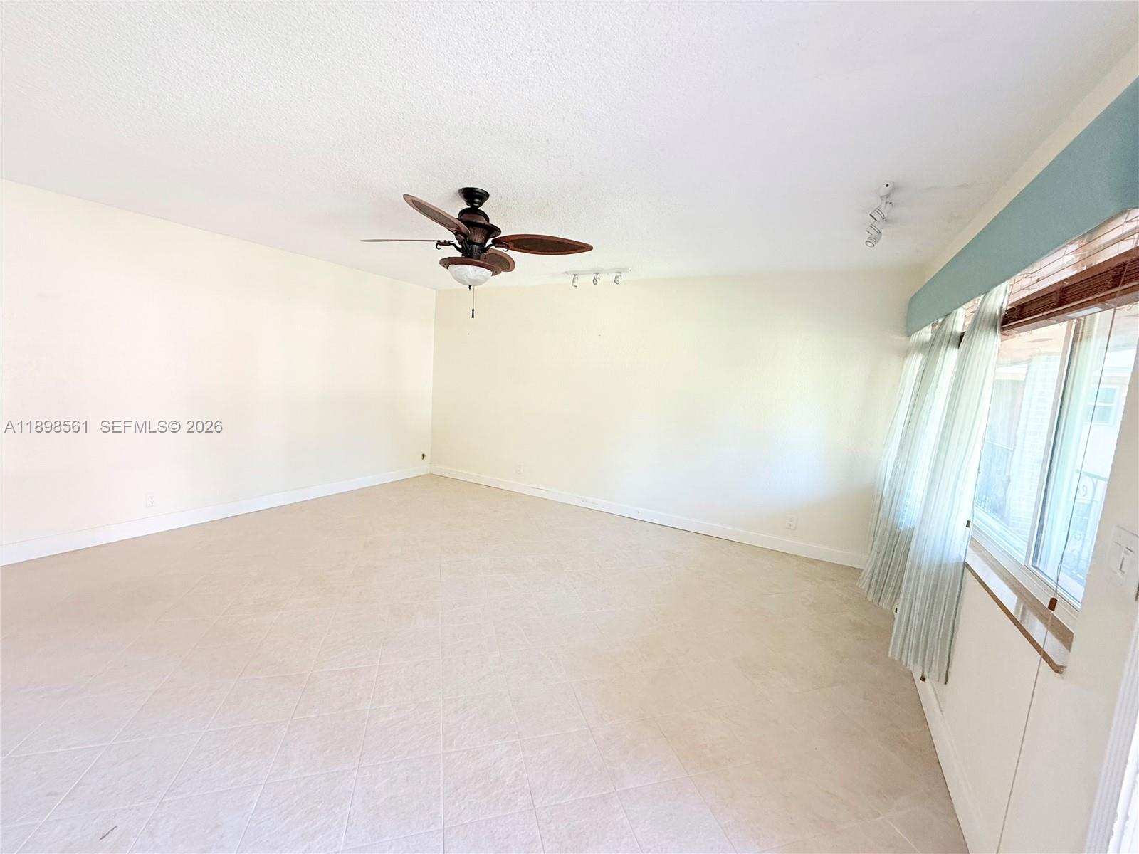 3600 Harrison Street, Unit 16B Hollywood, FL 33021 - Photo 18 of 34 a view of a room with a ceiling fan