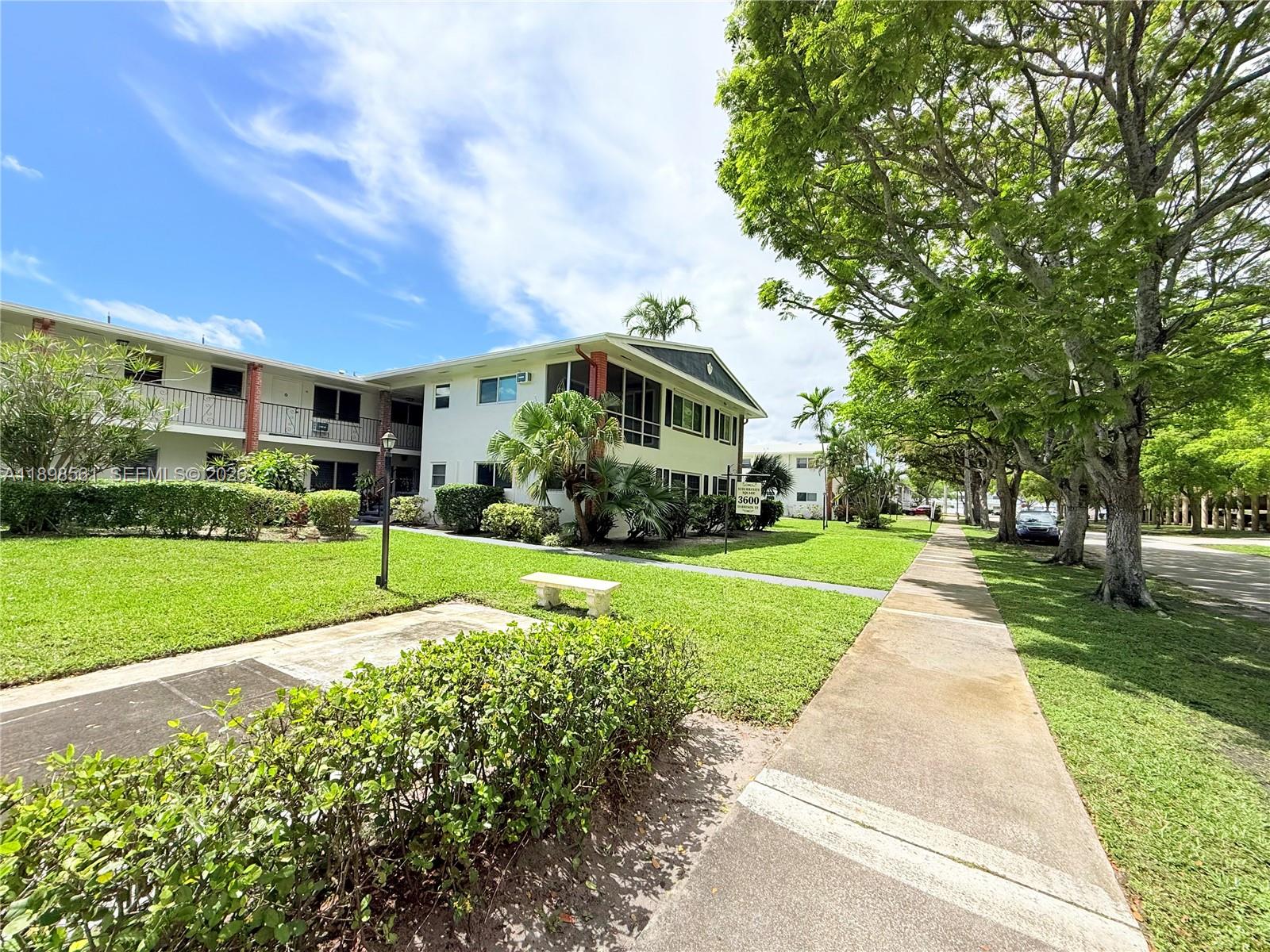 3600 Harrison Street, Unit 16B Hollywood, FL 33021 - Photo 22 of 34 a front view of a house with garden