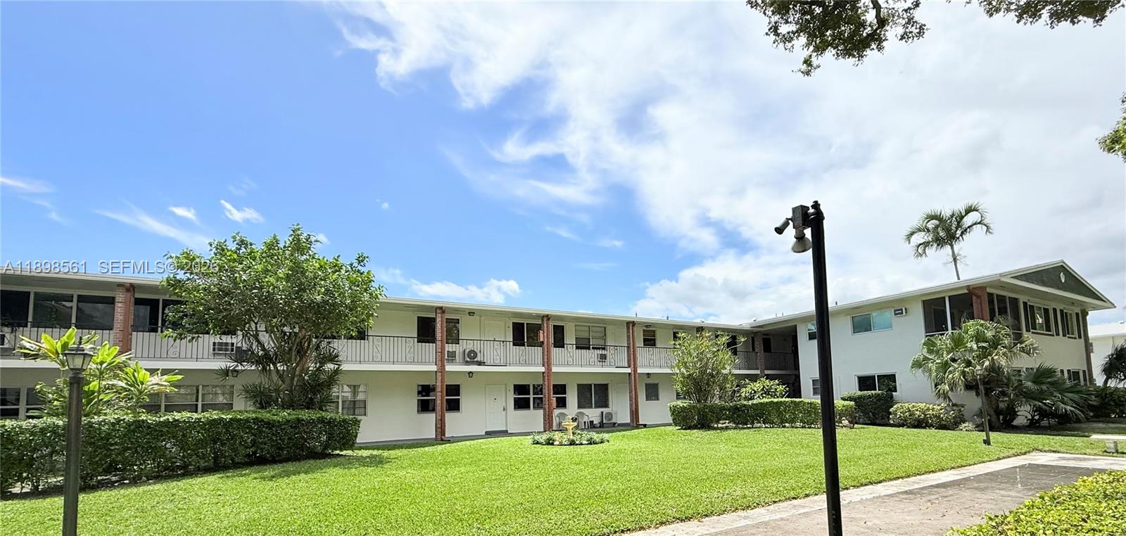 3600 Harrison Street, Unit 16B Hollywood, FL 33021 - Photo 24 of 34 a house view with a garden space