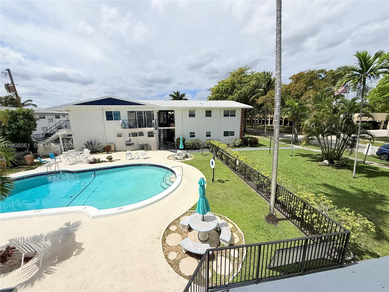 3600 Harrison Street, Unit 16B Hollywood, FL 33021 - Photo 28 of 34 a view of a house with backyard and sitting area
