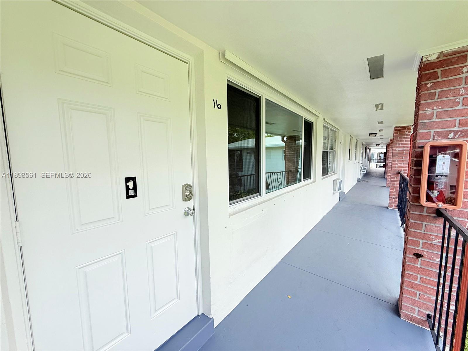 3600 Harrison Street, Unit 16B Hollywood, FL 33021 - Photo 30 of 34 a hallway with windows