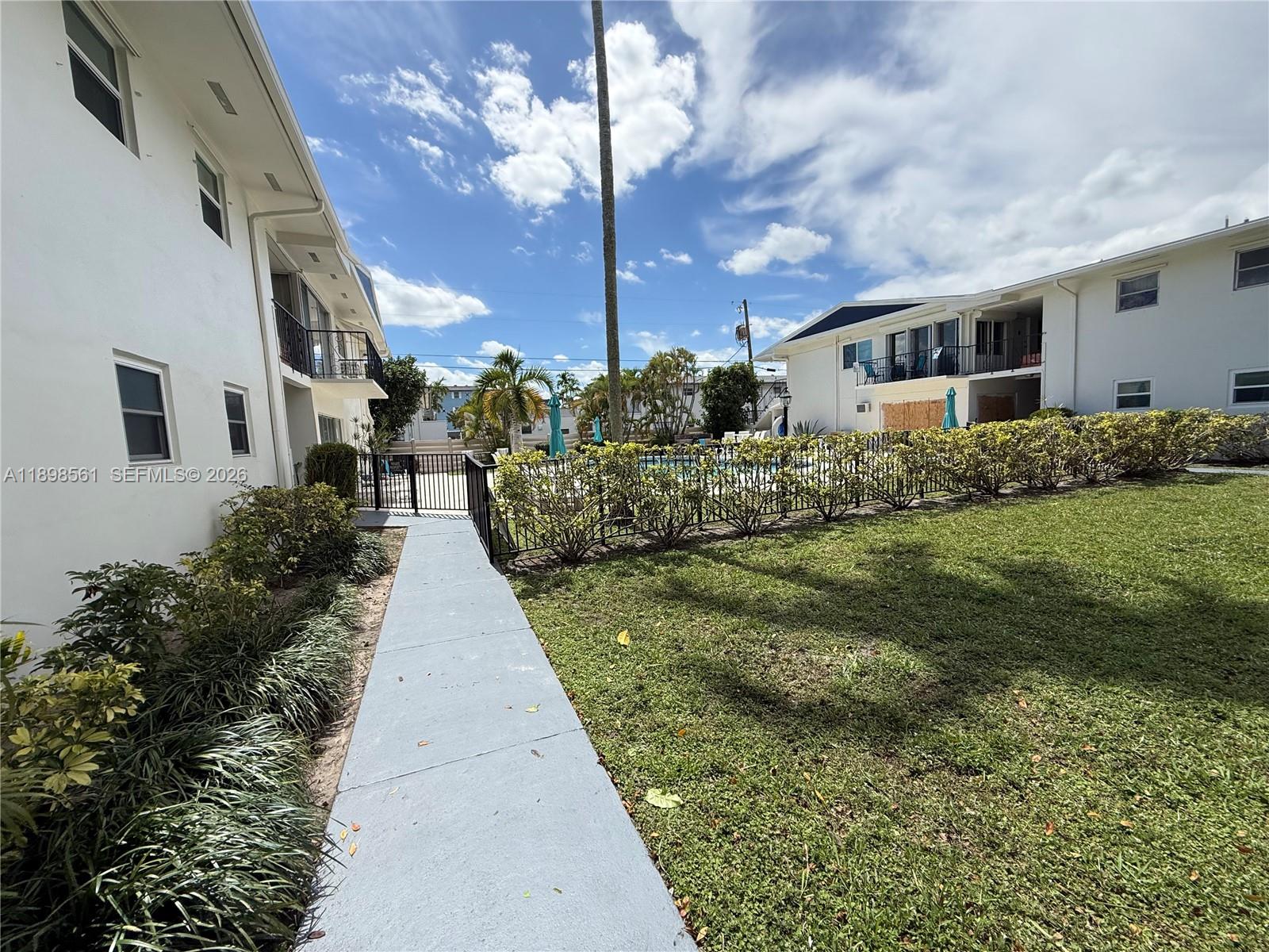 3600 Harrison Street, Unit 16B Hollywood, FL 33021 - Photo 32 of 34 a view of a house with a backyard
