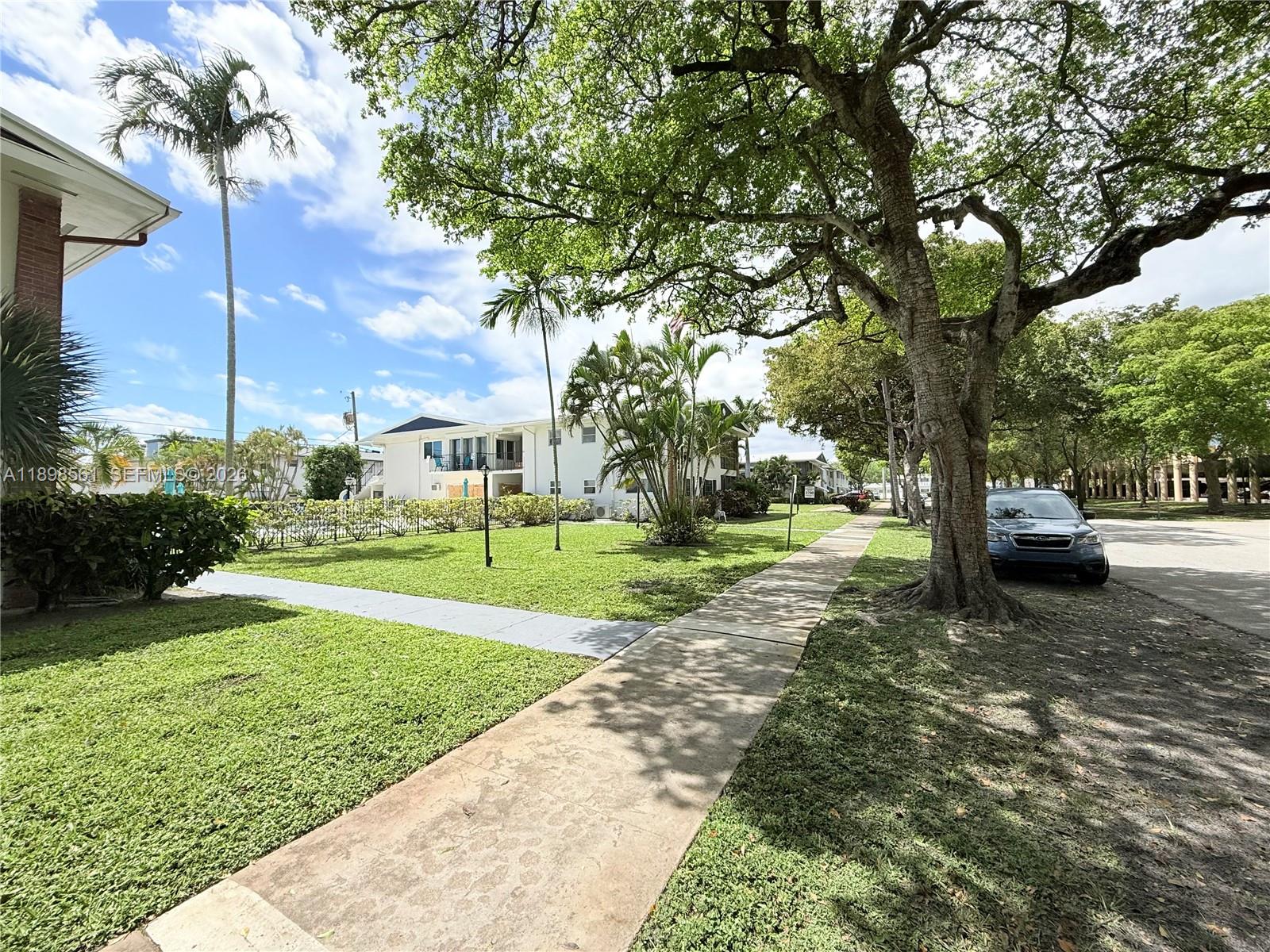 3600 Harrison Street, Unit 16B Hollywood, FL 33021 - Photo 33 of 34 a view of a park with large trees