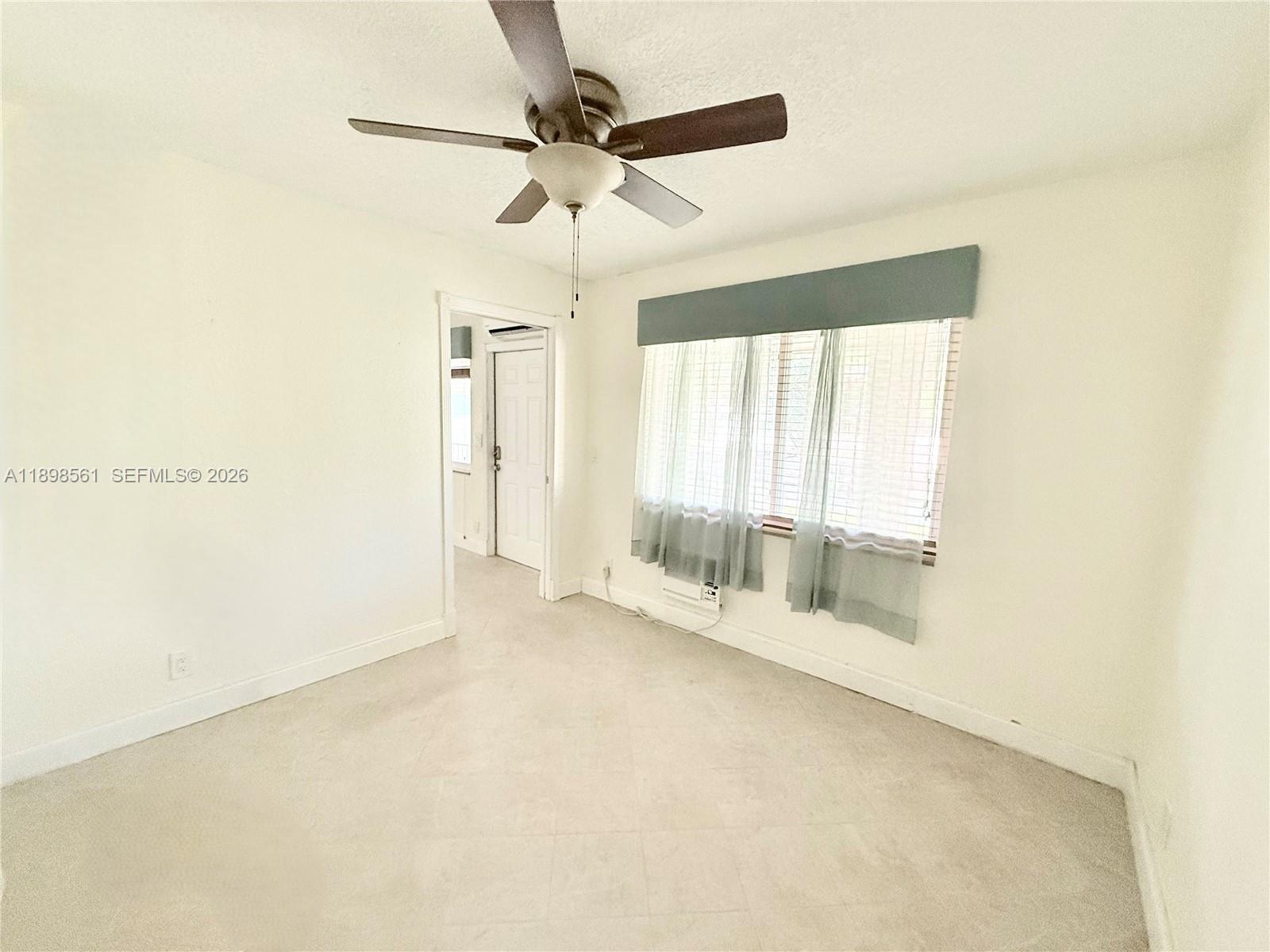 3600 Harrison Street, Unit 16B Hollywood, FL 33021 - Photo 10 of 34 an empty room with a empty space and windows