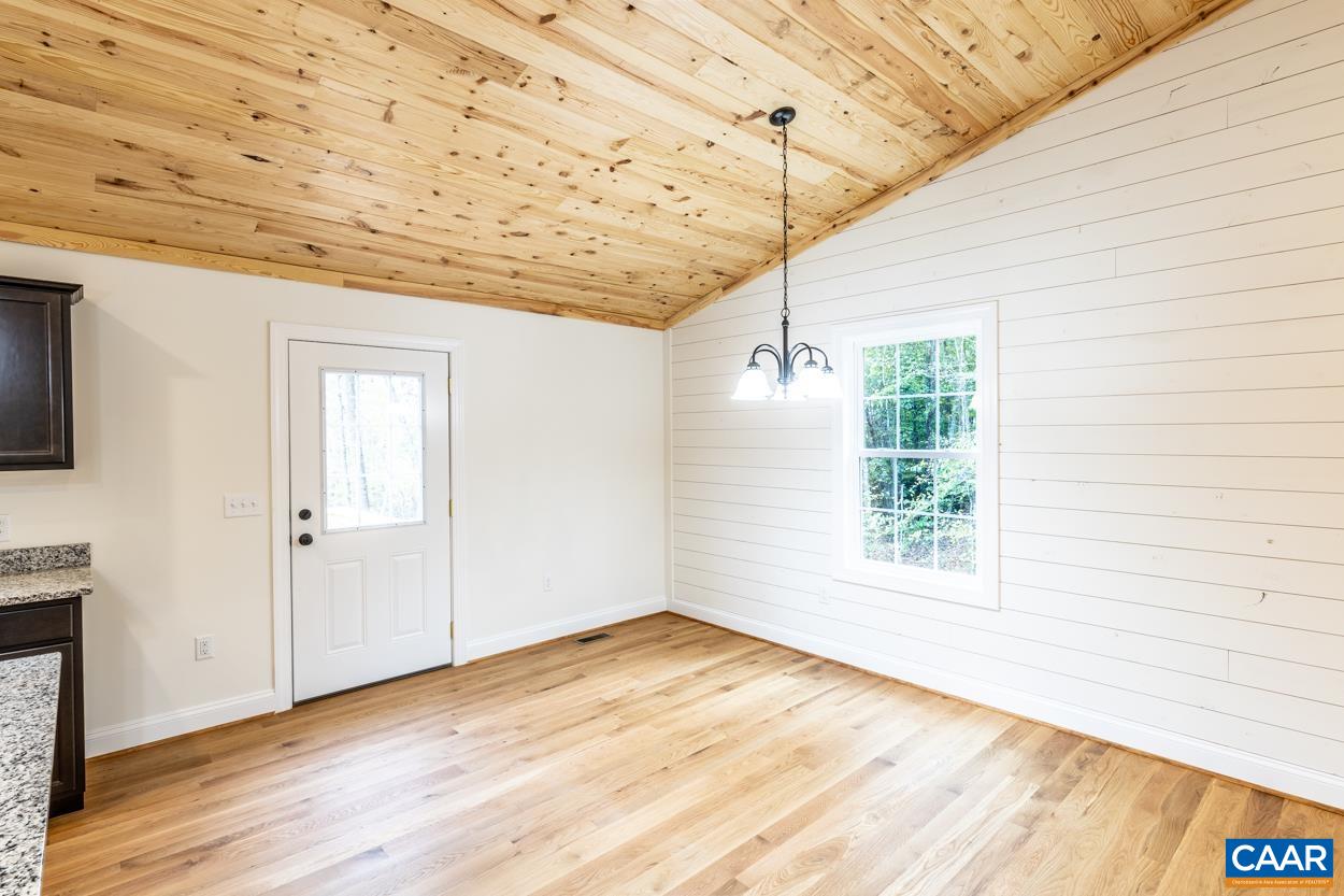 258 Twymans Mill Road Radiant, VA 22732 - Photo 19 of 59 a view of empty room with wooden floor and fan