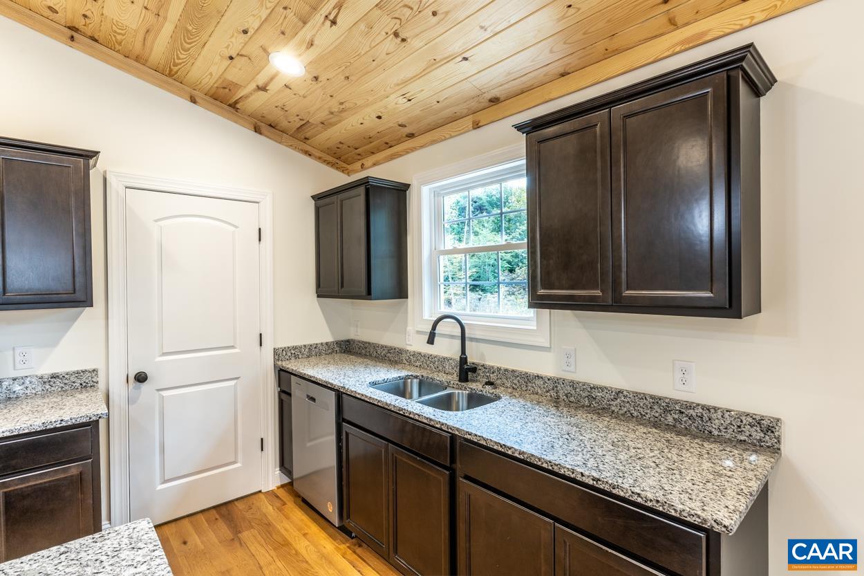 258 Twymans Mill Road Radiant, VA 22732 - Photo 22 of 59 a kitchen with a sink and a refrigerator