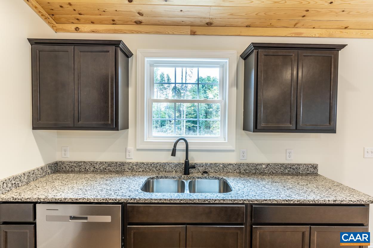 258 Twymans Mill Road Radiant, VA 22732 - Photo 24 of 59 a kitchen with granite countertop a sink and window