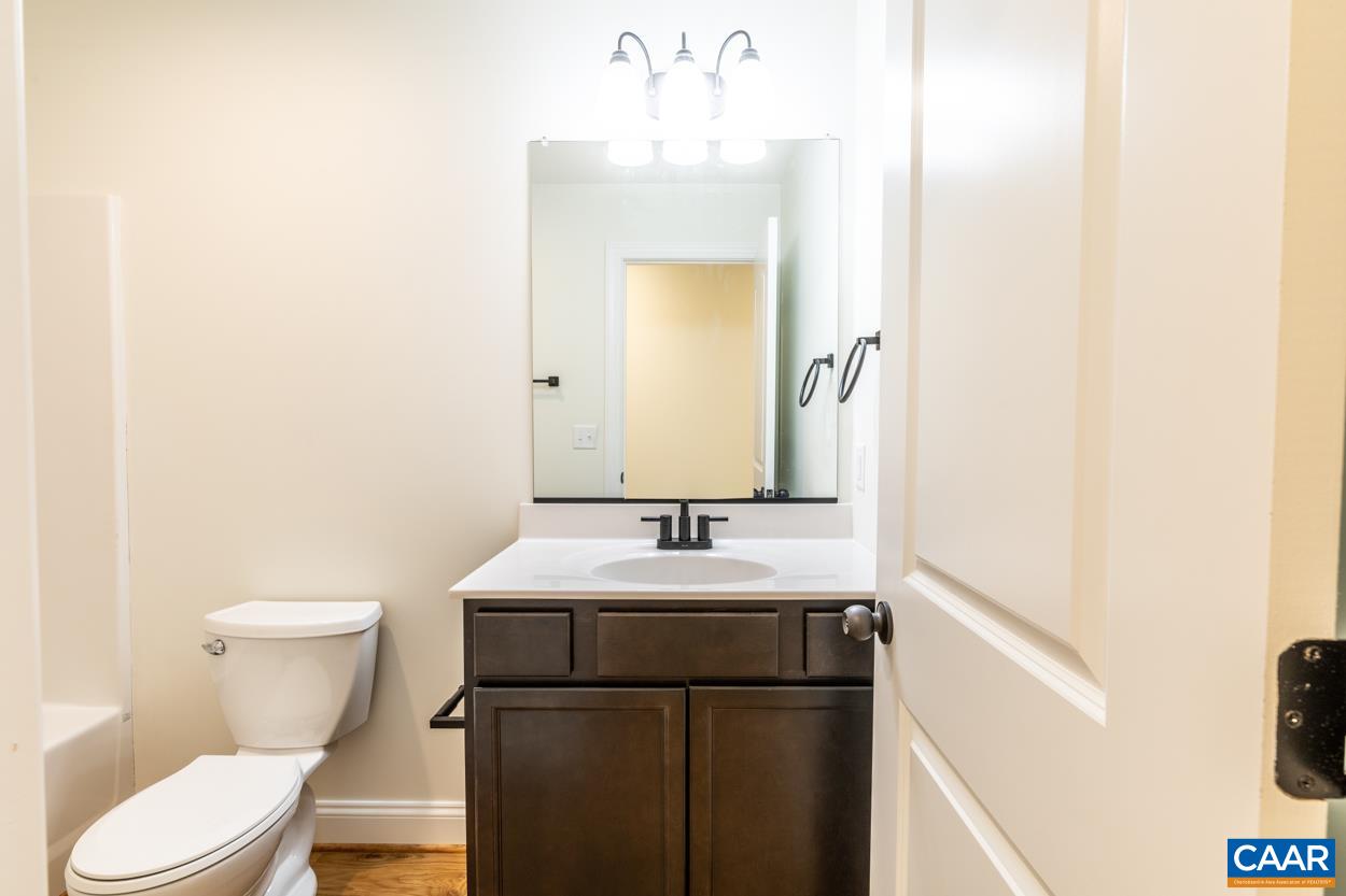 258 Twymans Mill Road Radiant, VA 22732 - Photo 26 of 59 a bathroom with a sink and a mirror