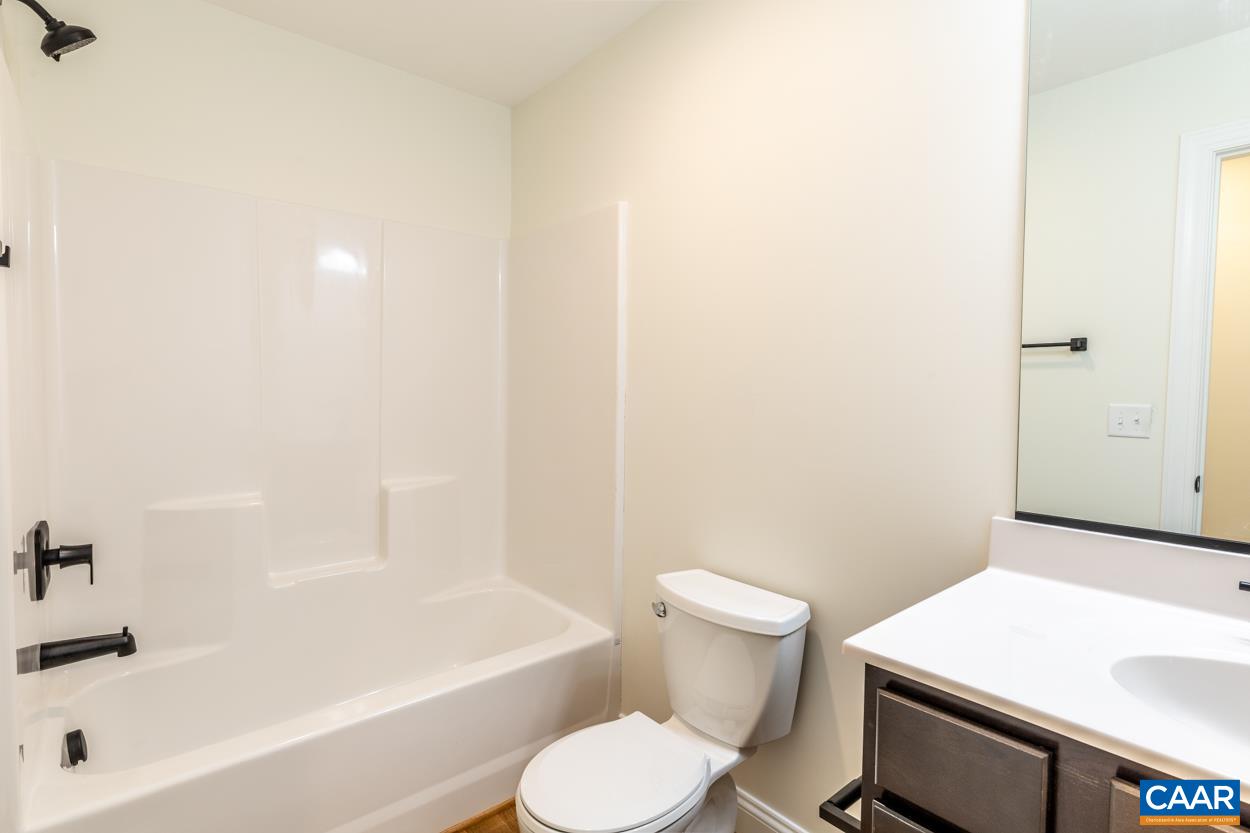 258 Twymans Mill Road Radiant, VA 22732 - Photo 27 of 59 a bathroom with a sink a toilet and bathtub