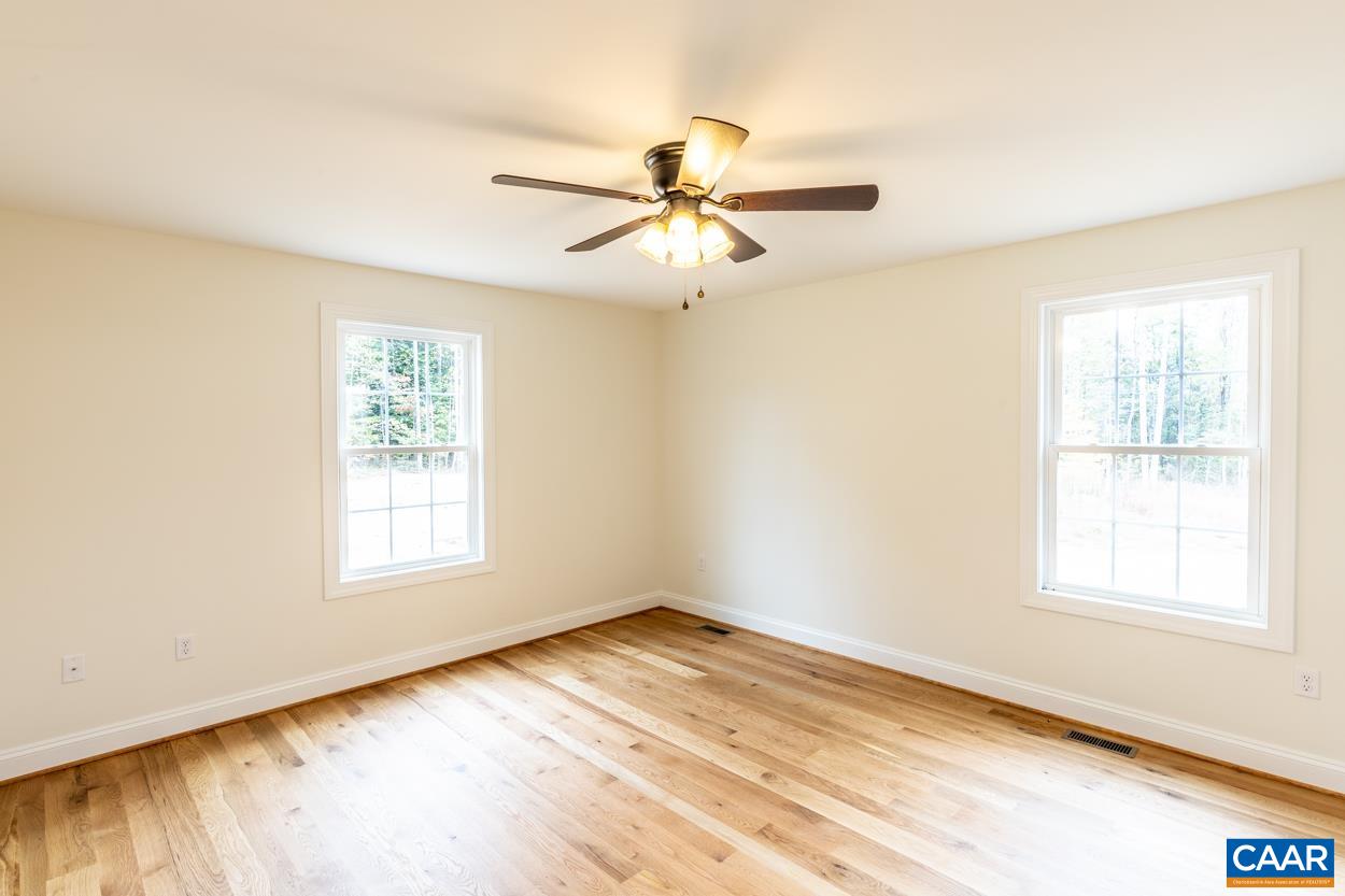 258 Twymans Mill Road Radiant, VA 22732 - Photo 28 of 59 wooden floor in an empty room with a window