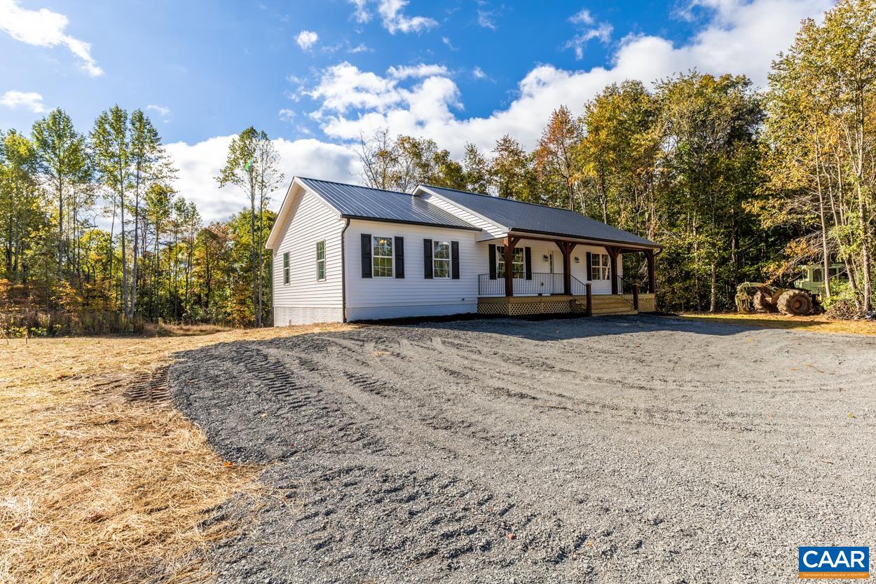 258 Twymans Mill Road Radiant, VA 22732 - Photo 3 of 59 a front view of a house with a yard and trees