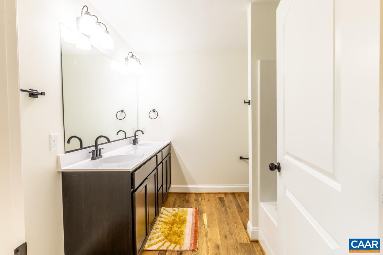 258 Twymans Mill Road Radiant, VA 22732 - Photo 32 of 59 a bathroom with a sink and a mirror