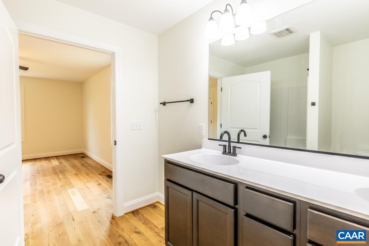 258 Twymans Mill Road Radiant, VA 22732 - Photo 33 of 59 a bathroom with a sink and a mirror