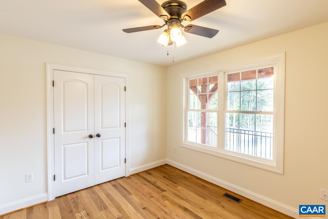 258 Twymans Mill Road Radiant, VA 22732 - Photo 40 of 59 a view of an empty room with a window and wooden floor
