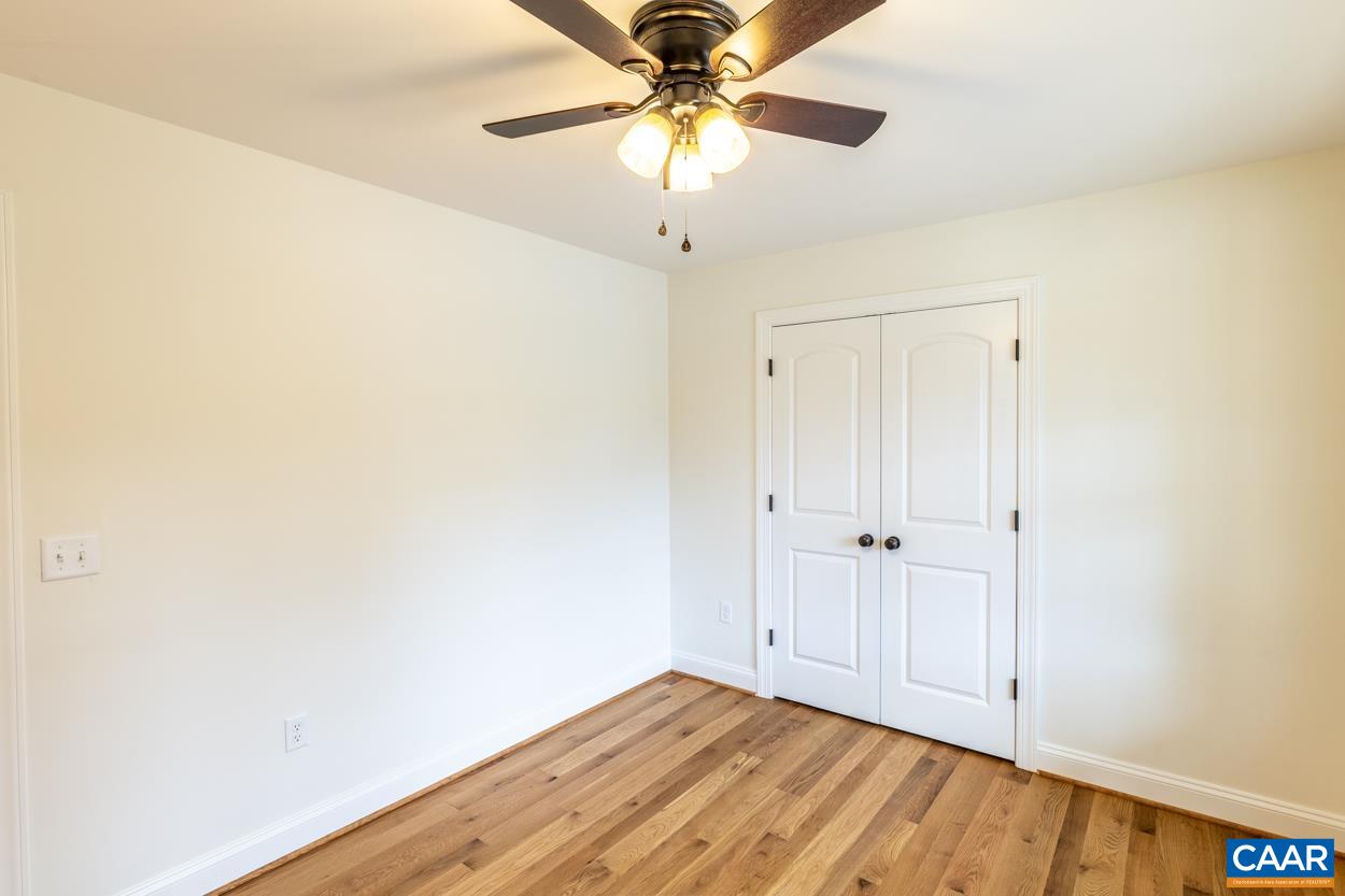 258 Twymans Mill Road Radiant, VA 22732 - Photo 41 of 59 a view of a room with a chandelier fan and wooden floor
