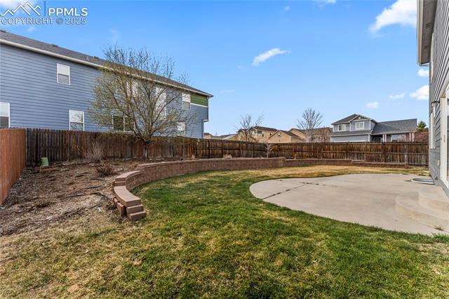 10158 Angeles Road Peyton, CO 80831 - Photo 34 of 43 View of yard with a patio and a fenced backyard
