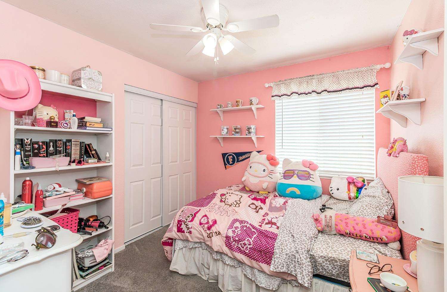 2831 Purvis Avenue Clovis, CA 93611 - Photo 16 of 26 a bedroom with a bed and closet