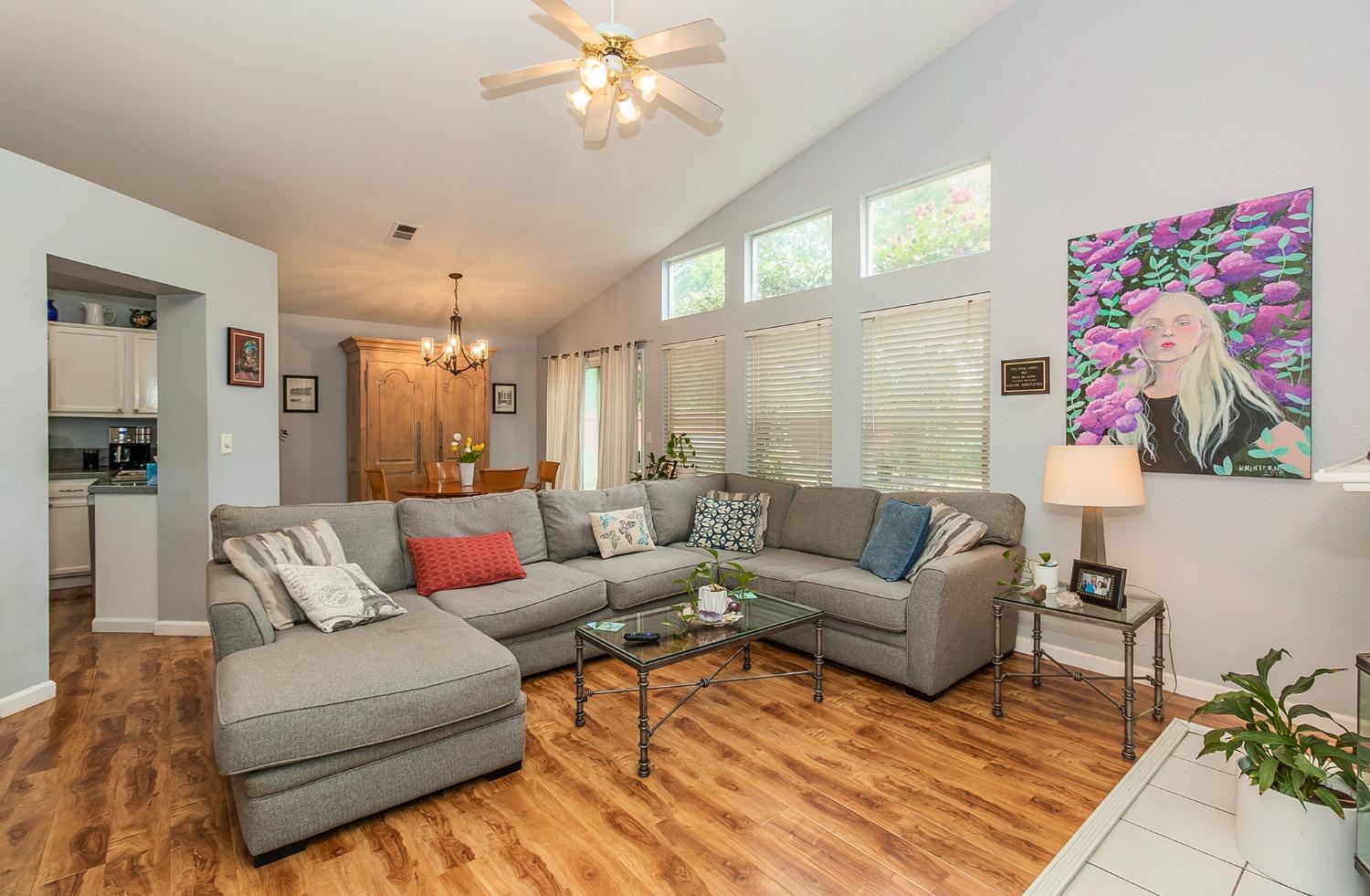 2831 Purvis Avenue Clovis, CA 93611 - Photo 5 of 26 a living room with furniture and a chandelier