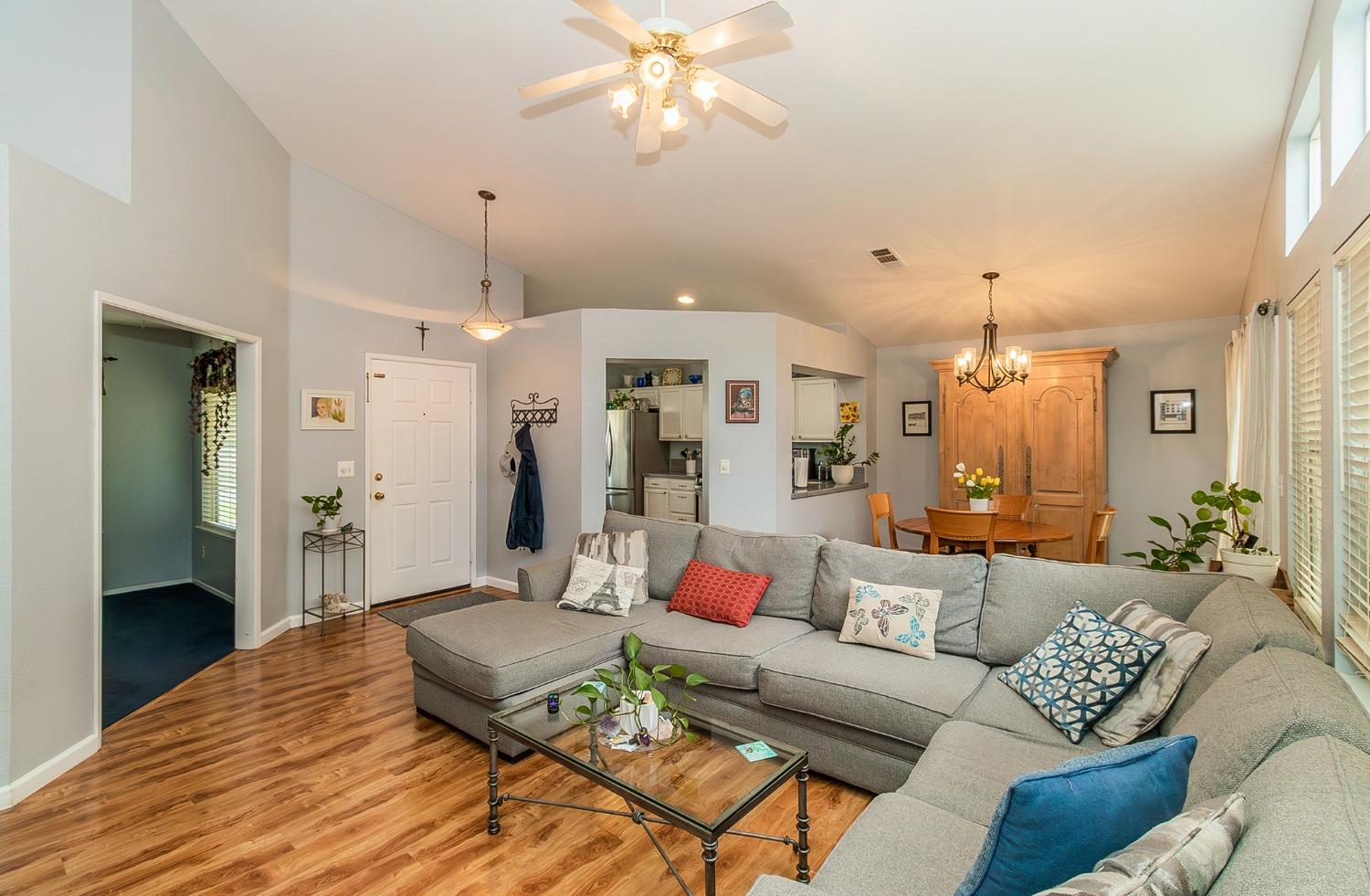 2831 Purvis Avenue Clovis, CA 93611 - Photo 6 of 26 a living room with furniture kitchen view and a chandelier