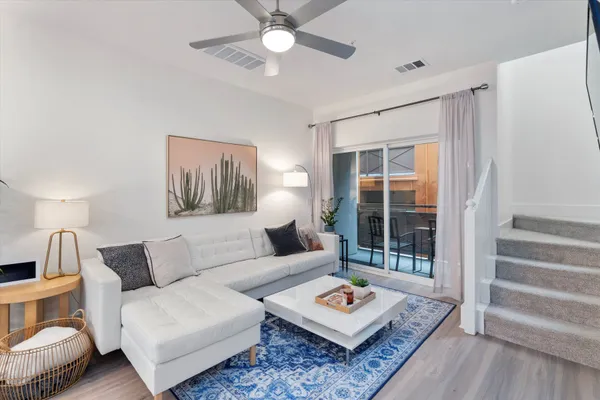 a living room with furniture and a window