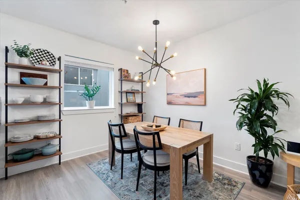 a dining room with furniture and window