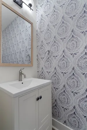 a bathroom with a sink and mirror
