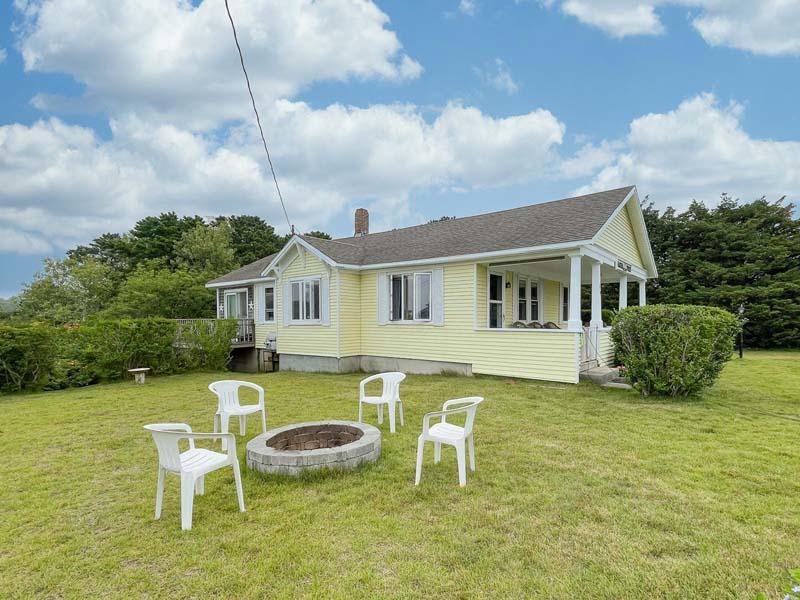 139 Shore Road Truro, MA 02666 - Photo 12 of 30 a front view of a house with swimming pool having outdoor seating